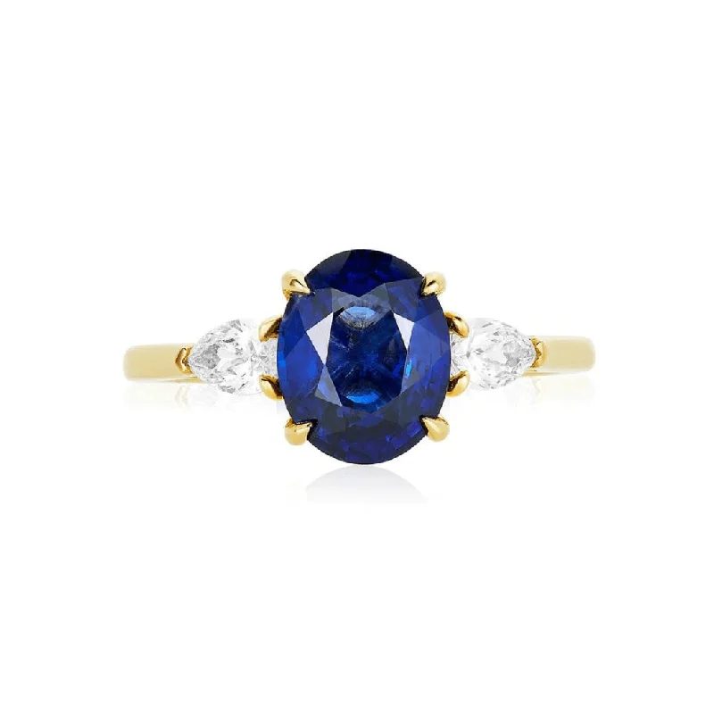 Unique diamond rings with colorful accents -Oval Cut Sapphire with Pear Cut Diamond Side Stones