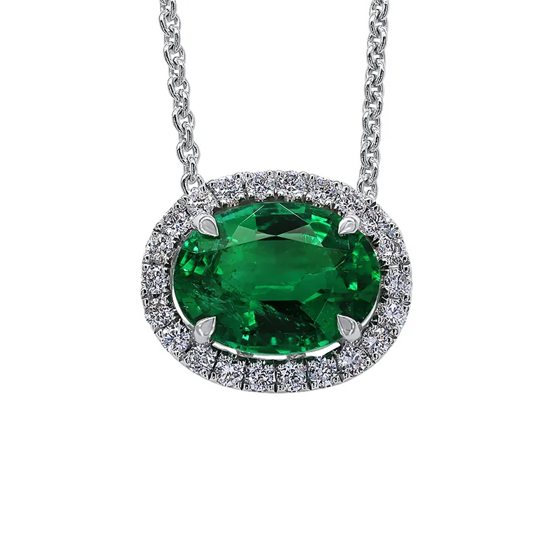 Luxury gold necklaces for special events -Emerald and Diamond Halo Pendant